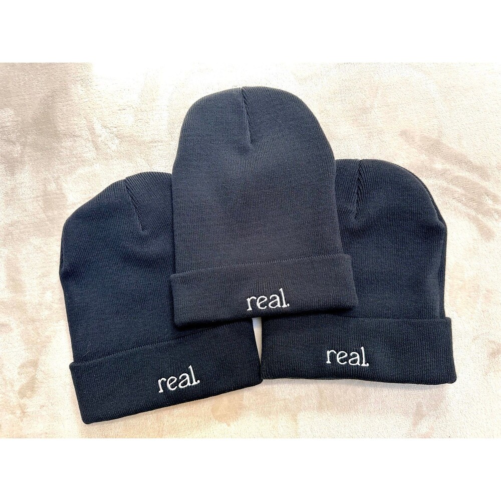 Bundle of 3 black beanies that say “real” embroidered